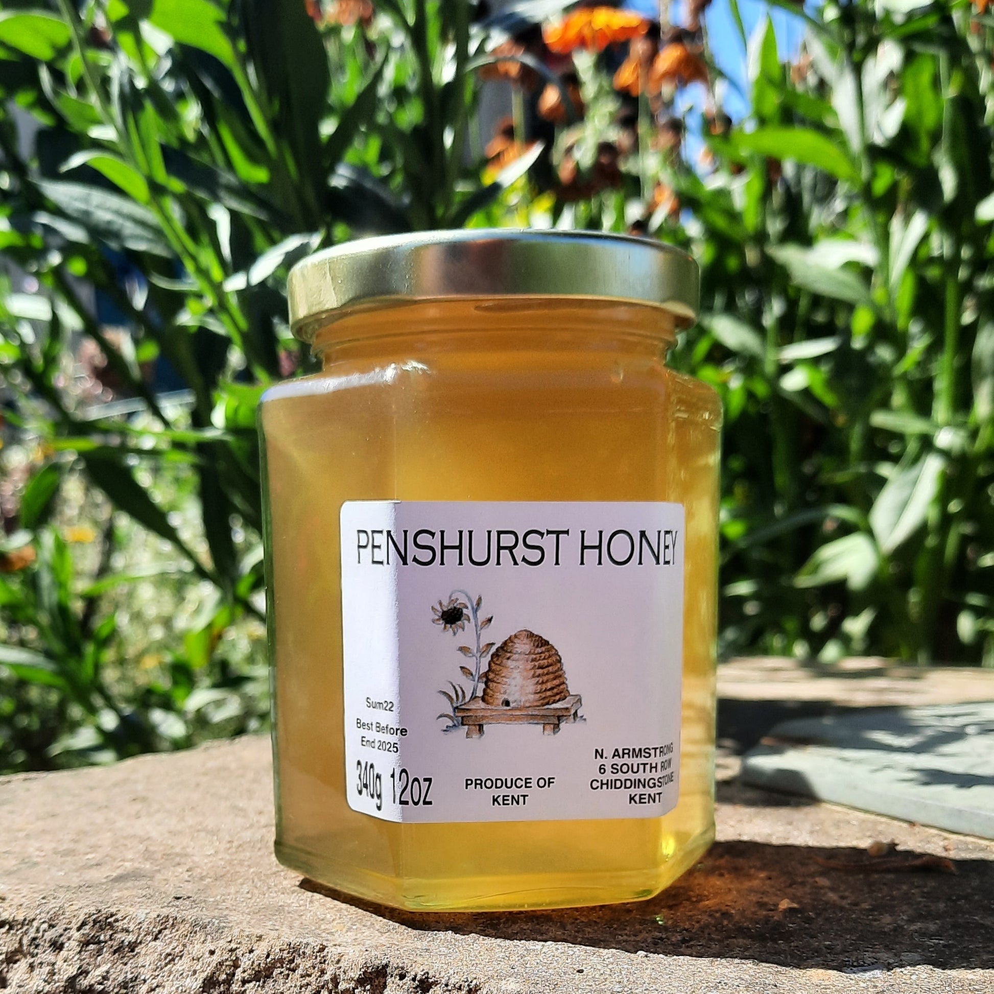 A jar of runny honey. The label says Penshurst Honey