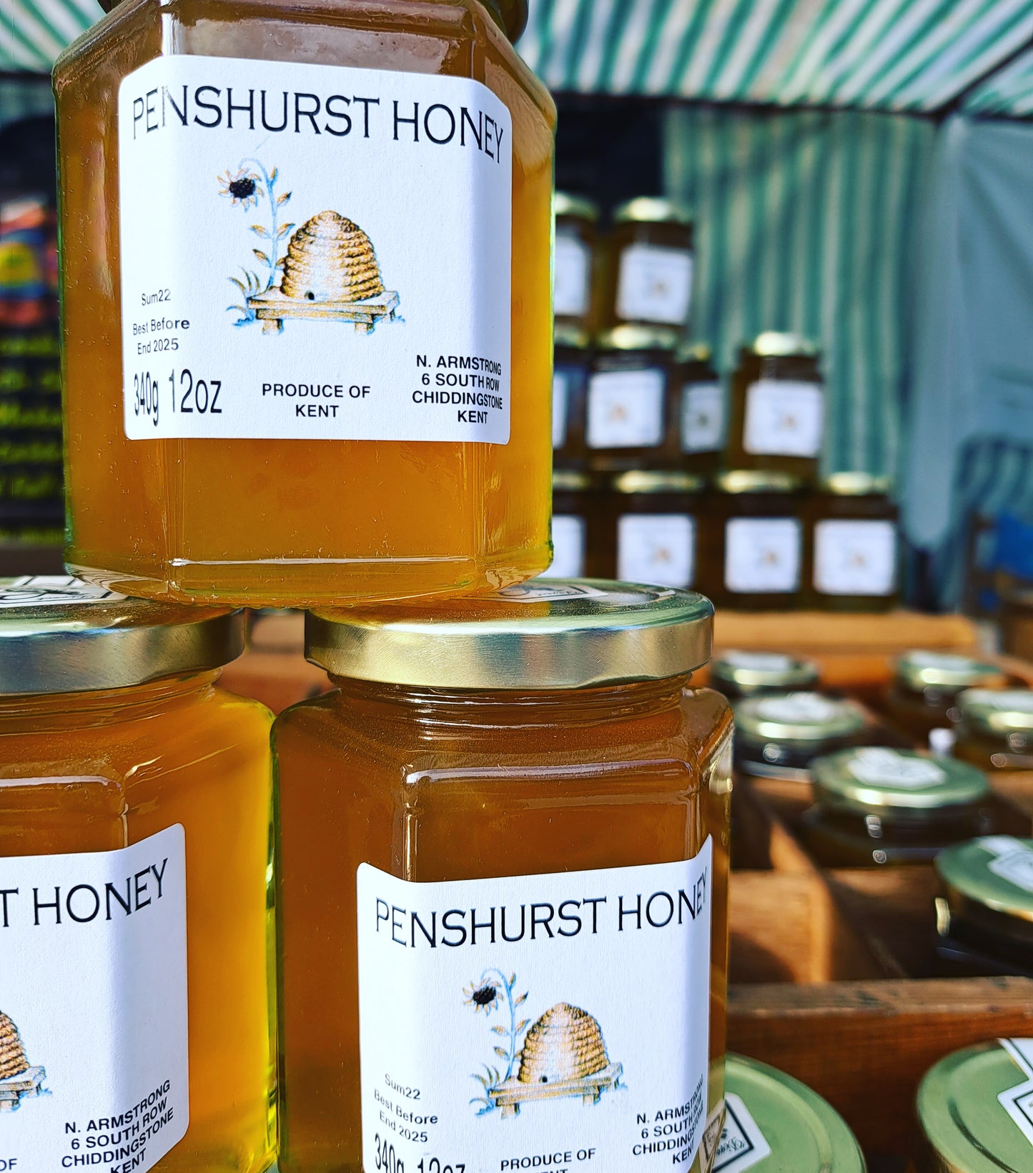 A pile of jars of Penshurst Honey. 